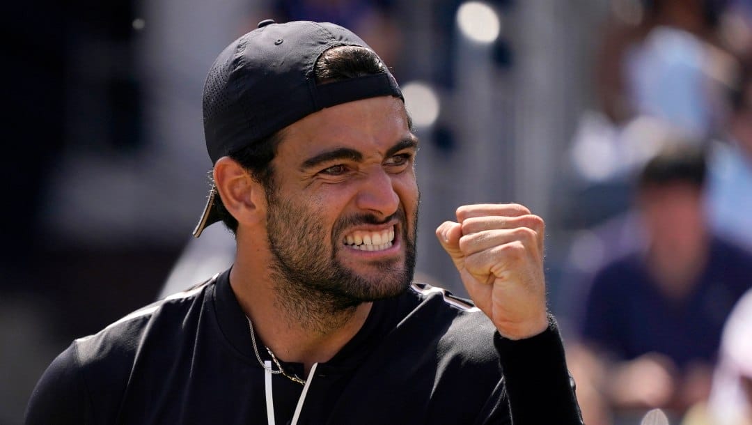 Matteo Berrettini of Italy reacts after scoring a point against Tommy Paul of the United States during their quarterfinal tennis match at the Queen's Club Championships in London, Friday, June 17, 2022. Berrettini will compete in the 2022 Wimbledon tennis tournament.