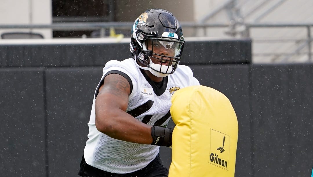 Jacksonville Jaguars outside linebacker Travon Walker (44) performs a drill an NFL football practice, Tuesday, May 31, 2022, in Jacksonville, Fla. (AP Photo/John Raoux)