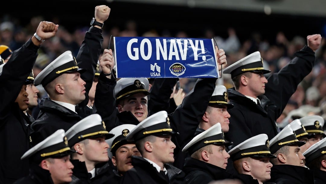 Navy midshipman cheer during the second half of an NCAA college football game against Army on Saturday, Dec. 11, 2021, in East Rutherford, N.J. Navy won 17-13.
