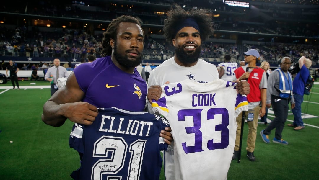 Minnesota Vikings' Dalvin Cook, left, and Dallas Cowboys' Ezekiel Elliott, right, swap jerseys after their NFL football game in Arlington, Texas, Sunday, Nov. 10, 2019. (AP Photo/Michael Ainsworth)
