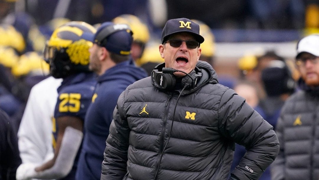 Michigan head coach Jim Harbaugh yells from the sideline during the second half of an NCAA college football game against Ohio State, Saturday, Nov. 27, 2021, in Ann Arbor, Mich.