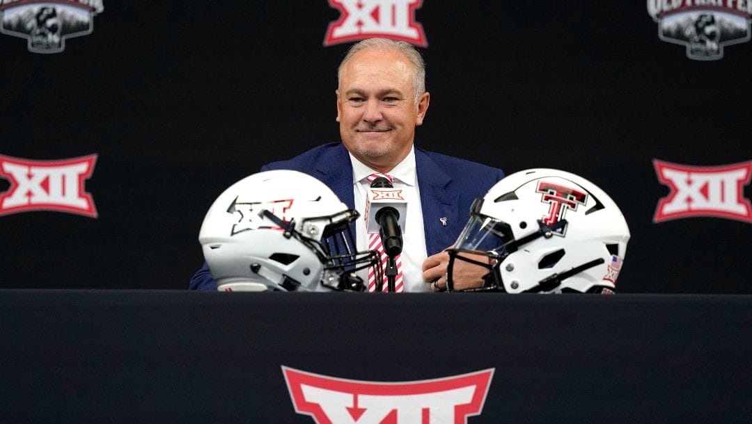 Texas Tech head coach Joey McGuire smiles before speaking to reporters at the NCAA college football Big 12 media days in Arlington, Texas, Thursday, July 14, 2022.