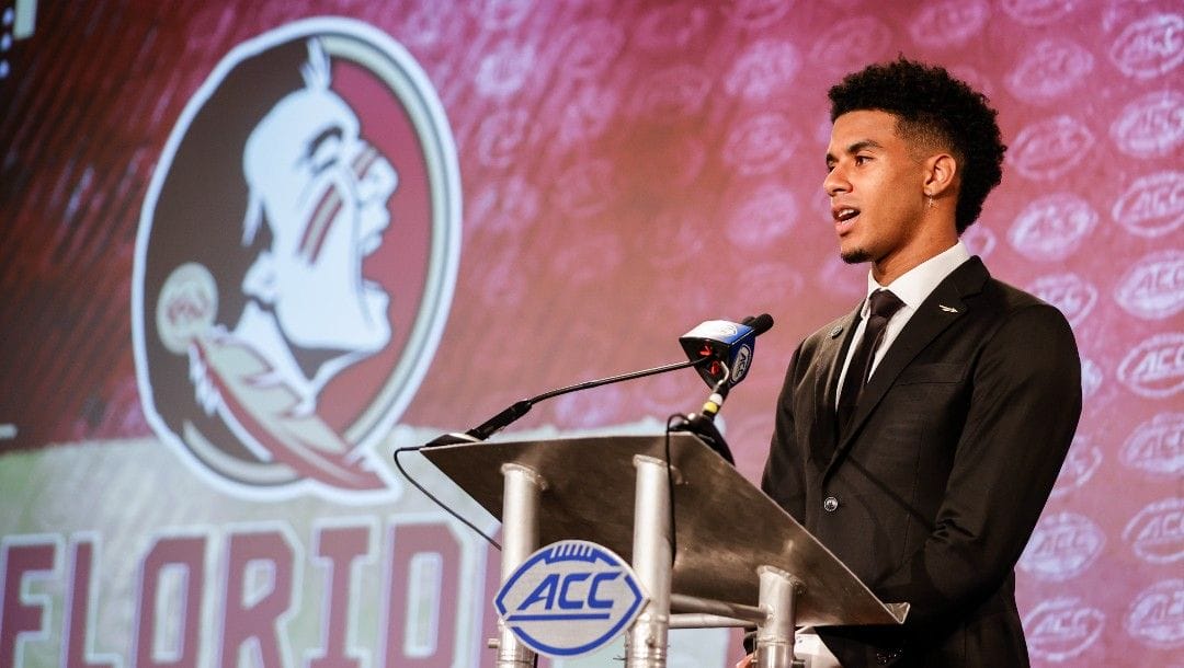 Florida State quarterback Jordan Travis answers a question at the NCAA college football Atlantic Coast Conference Media Days in Charlotte, N.C., Wednesday, July 20, 2022.
