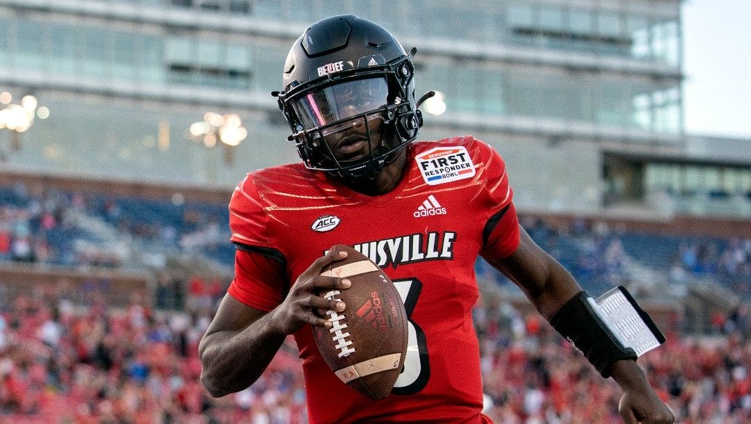 Louisville quarterback Malik Cunningham (3) runs in for a touchdown during the second half of the First Responder Bowl NCAA college football game Tuesday, Dec. 28, 2021, in Dallas. Air Force won 31-28.