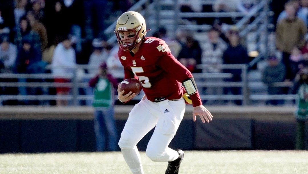 Boston College quarterback Phil Jurkovec (5) rushes with the ball during the first half of an NCAA college football game against Florida State, Saturday, Nov. 20, 2021, in Boston.