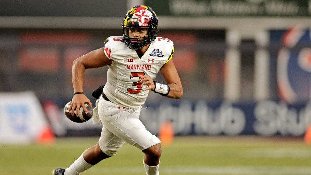 Maryland quarterback Taulia Tagovailoa (3) scrambles against Virginia Tech during the second half of the Pinstripe Bowl NCAA college football game in New York, Wednesday, Dec. 29, 2021. Maryland won 54-10.
