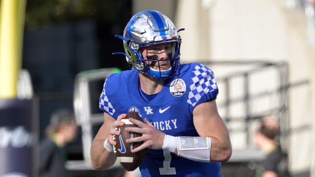 Kentucky quarterback Will Levis (7) looks for a receiver during the second half of the Citrus Bowl NCAA college football game against Iowa, Saturday, Jan. 1, 2022, in Orlando, Fla.