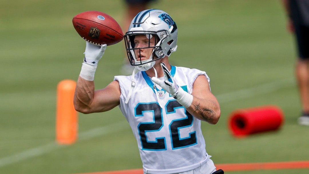 Carolina Panthers running back Christian McCaffrey catches the football during NFL football practice in Charlotte, N.C., Wednesday, June 8, 2022.