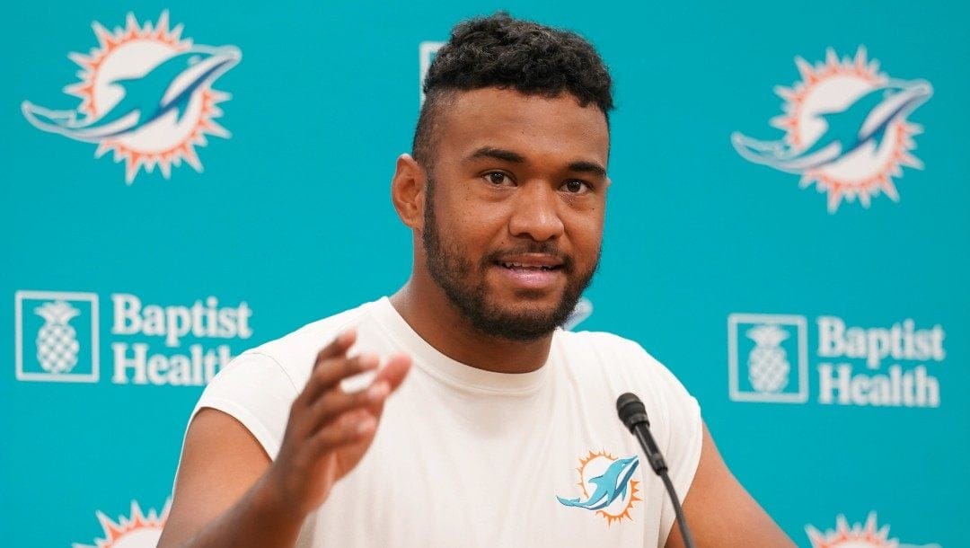 Miami Dolphins quarterback Tua Tagovailoa gestures during a news conference at the Dolphins NFL football training facility, Wednesday, April 20, 2022, in Miami Gardens, Fla.