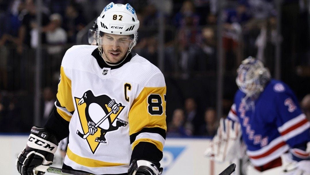 Pittsburgh Penguins center Sidney Crosby (87) reacts as he skates past New York Rangers goaltender Igor Shesterkin during the first period in Game 7 of an NHL hockey Stanley Cup first-round playoff series, Sunday, May 15, 2022, in New York.
