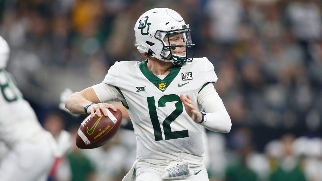 Baylor quarterback Blake Shapen (12) throws a pass in the second half of an NCAA college football game against Oklahoma State for the Big 12 Conference championship in Arlington, Texas, Saturday, Dec. 4, 2021. (AP Photo/Tim Heitman)