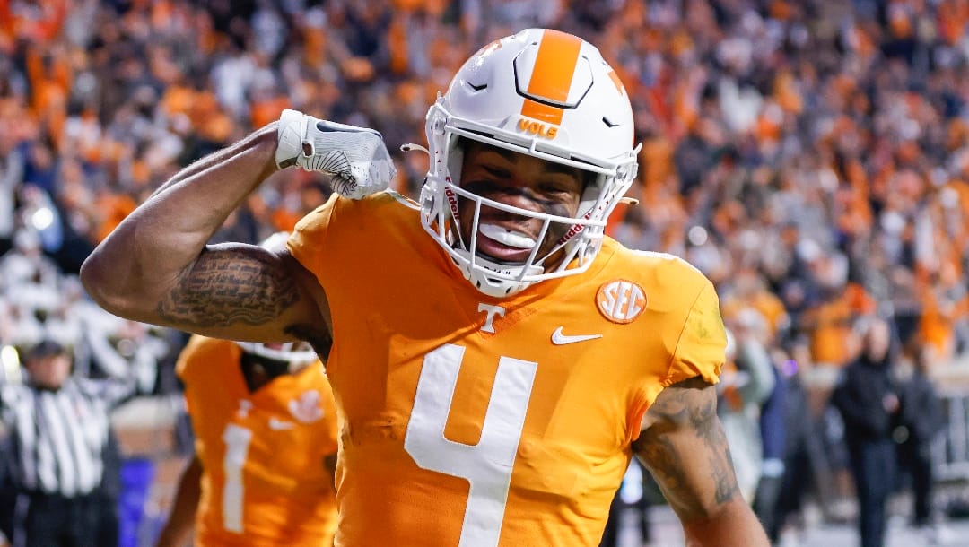 Tennessee wide receiver Cedric Tillman (4) celebrates scoring a touchdown during the first half of an NCAA college football game against Vanderbilt Saturday, Nov. 27, 2021, in Knoxville, Tenn. (AP Photo/Wade Payne)