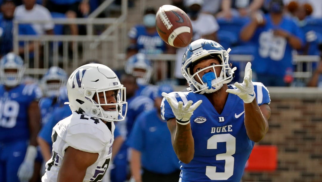 Duke wide receiver Darrell Harding Jr. (3) hauls in a pass for a big gain against Northwestern defensive back Rod Heard II (24) during the first half of an NCAA college football game in Durham, N.C., Saturday, Sept. 18, 2021. Duke scored shortly after this play. (AP Photo/Chris Seward)