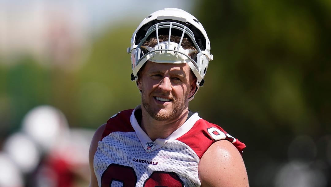 Arizona Cardinals defensive lineman J.J. Watt pauses on the practice field as he takes part in drills at the NFL football team's practice facility Tuesday, June 14, 2022, in Tempe, Ariz.