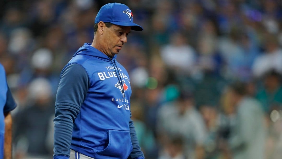 Toronto Blue Jays manager Charlie Montoyo walks on the field after Bradley Zimmer was hit by a pitch during the seventh inning of a baseball game against the Seattle Mariners, Thursday, July 7, 2022, in Seattle. Zimmer stayed in the game.
