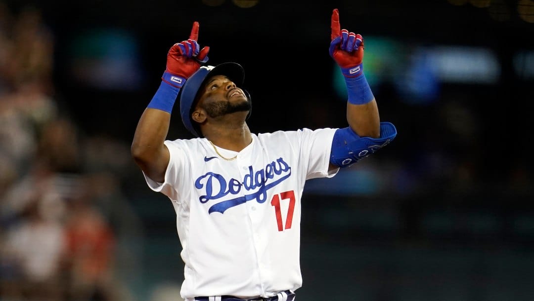 Los Angeles Dodgers' Hanser Alberto points skyward after an RBI double during the third inning of the team's baseball game against the San Francisco Giants on Thursday, July 21, 2022, in Los Angeles.