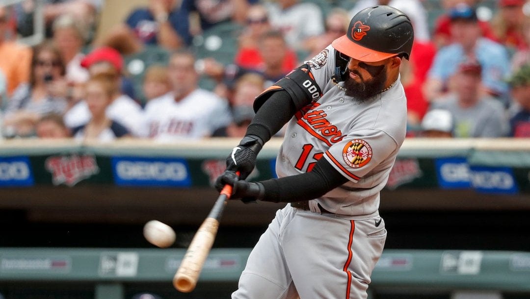 Baltimore Orioles' Rougned Odor hits a solo home run against the Minnesota Twins in the fifth inning of a baseball game, Sunday, July 3, 2022, in Minneapolis.