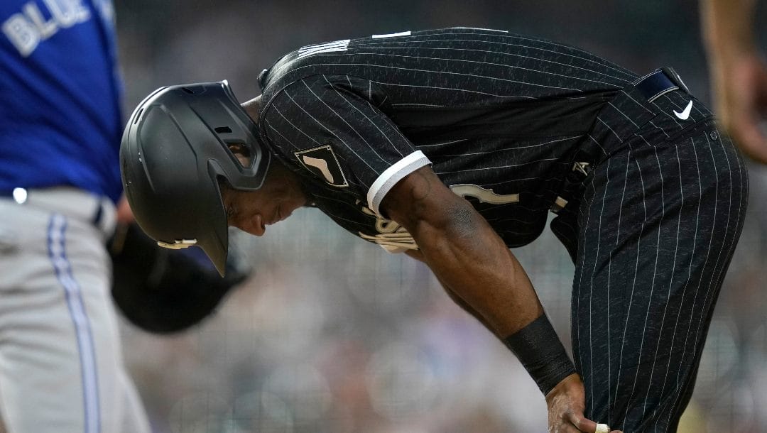 Chicago White Sox's Tim Anderson puts his head down after being picked off first by Toronto Blue Jays starting pitcher Jose Berrios during the fourth inning of a baseball game Monday, June 20, 2022, in Chicago.