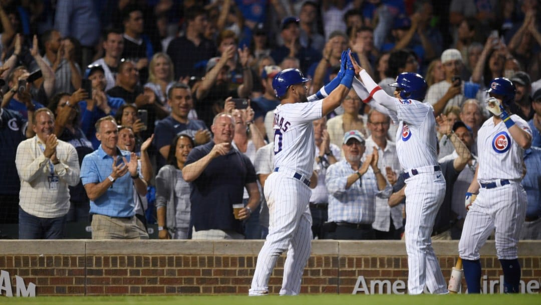 Chicago Cubs' Willson Contreras left, celebrates with Christopher Morel, after Contreras hit a two-run home run against the Cincinnati Reds during the fifth inning of a baseball game Wednesday, June 29, 2022, in Chicago.
