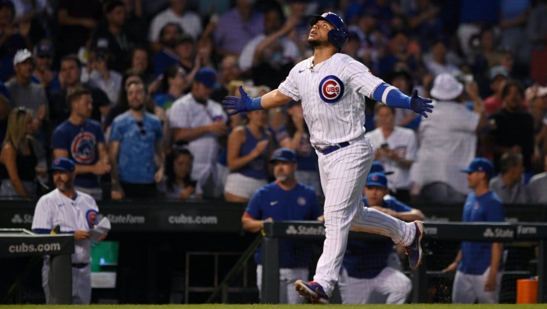 Chicago Cubs' Willson Contreras celebrates while running the bases after hitting a two-run home run during the fifth inning of the team's baseball game against the Cincinnati Reds on Wednesday, June 29, 2022, in Chicago.