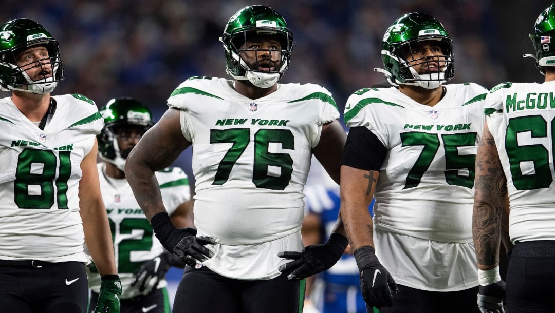 New York Jets tackle George Fant (76) and New York Jets offensive lineman Alijah Vera-Tucker (75) watch a video replay