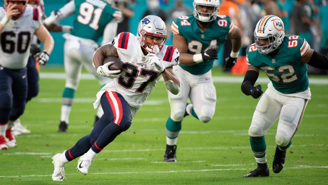 New England Patriots running back Damien Harris runs with the ball