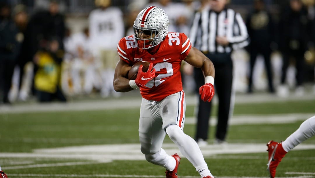 Ohio State running back TreVeyon Henderson plays against Purdue during an NCAA college football game Saturday, Nov. 13, 2021, in Columbus, Ohio. (