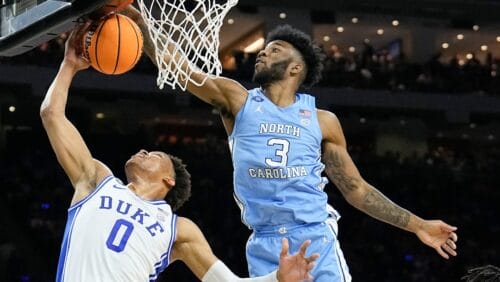 North Carolina's Dontrez Styles (3) blocks a shot by Duke's Wendell Moore Jr. (0) during the first half of a college basketball game in the semifinal round of the Men's Final Four NCAA tournament, Saturday, April 2, 2022, in New Orleans. (AP Photo/Brynn Anderson)