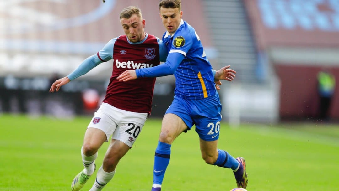 West Ham's Jarrod Bowen, left, and Brighton's Solly March vie for the ball.