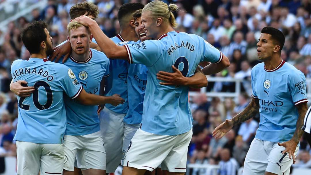 Manchester City's Bernardo Silva, left, celebrates with teammates after scoring.