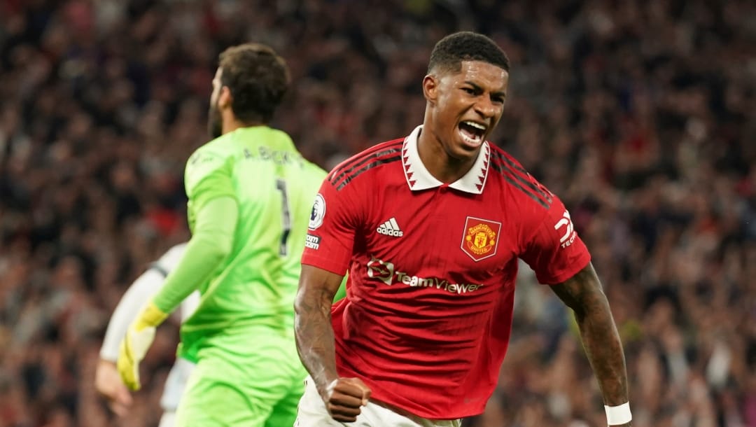 Manchester United's Marcus Rashford celebrates after scoring his side's second goal during the English Premier League soccer match between Manchester United and Liverpool at Old Trafford stadium, in Manchester, England, Monday, Aug 22, 2022.