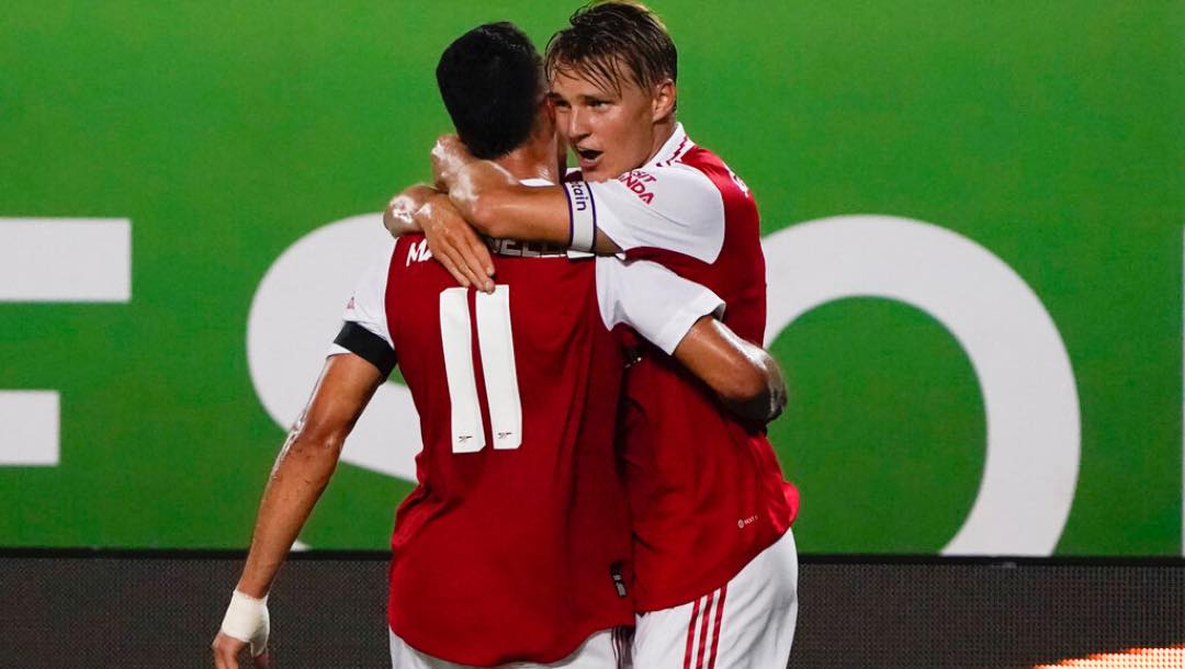 Arsenal's Martin Odegaard, right, celebrates his goal against Chelsea with Gabriel Martinelli.