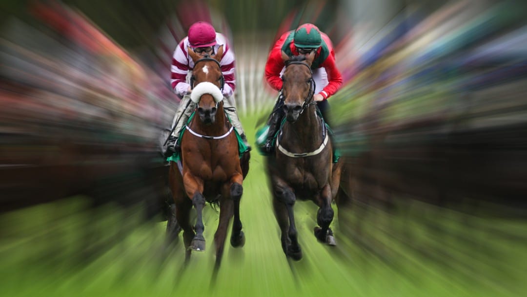 An action shot of two horses racing side-by-side.