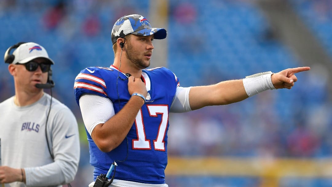 Buffalo Bills quarterback Josh Allen gestures from the sideline during the second half of a preseason NFL football game against the Indianapolis Colts in Orchard Park, N.Y., Saturday, Aug. 13, 2022. (AP Photo/Adrian Kraus)