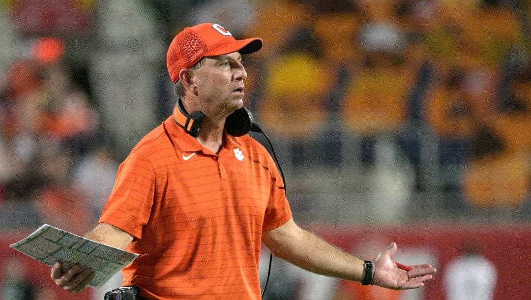 Clemson head coach Dabo Swinney questions an official after a play during the first half of the Cheez-It Bowl NCAA college football game against Iowa State, Wednesday, Dec. 29, 2021, in Orlando, Fla.