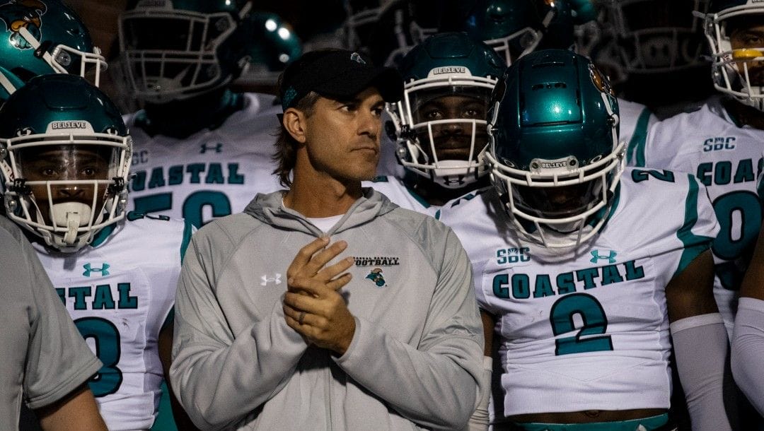 Coastal Carolina coach Jamey Chadwell and players wait in the tunnel before heading out onto the field, for an NCAA college football game against Appalachian State on Thursday, Oct. 21, 2021, in Boone, N.C.