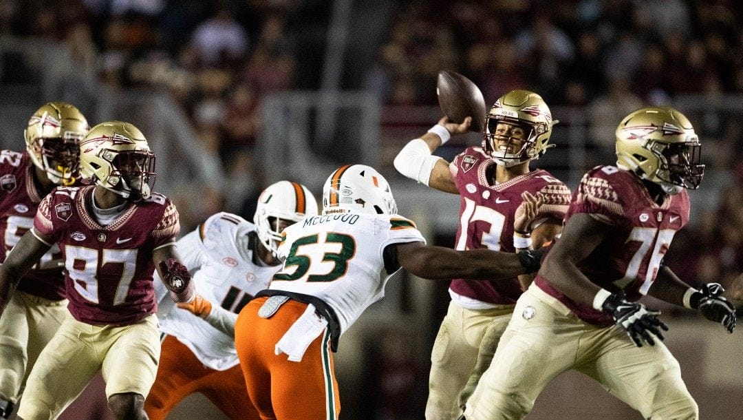 Florida State quarterback Jordan Travis (13) passes against Miami in the second half of an NCAA college football game in Tallahassee, Fla., Saturday, Nov. 13, 2021. Florida State defeated Miami 32-28.