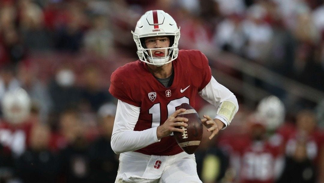 Stanford's Tanner McKee looks to pass against California during the first half of an NCAA college football game in Stanford, Calif., on Nov. 20, 2021. Stanford has embraced bringing in players such as McKee after their two-year Mormon missions, valuing their life experience.