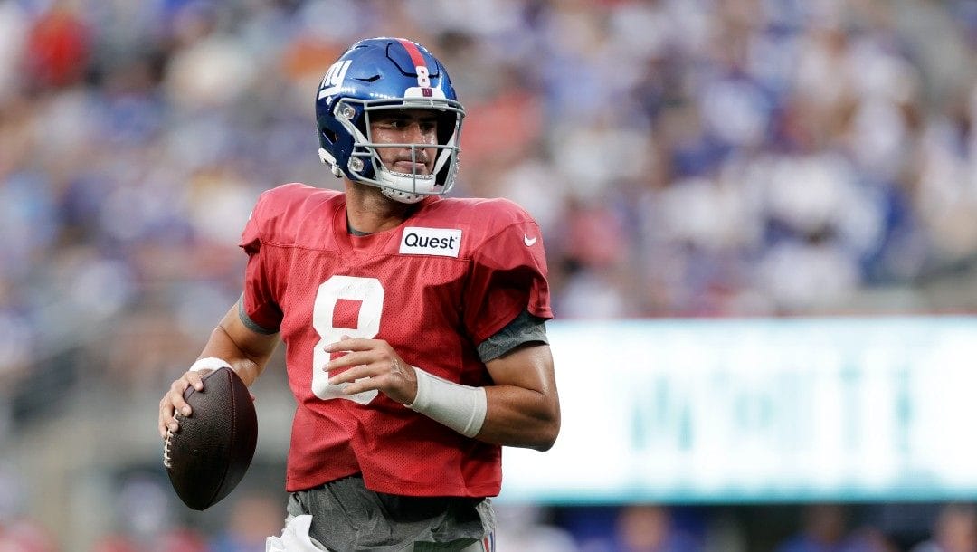 New York Giants quarterback Daniel Jones (8) passes during the NFL football team's practice in East Rutherford, N.J., Friday, Aug. 5, 2022.