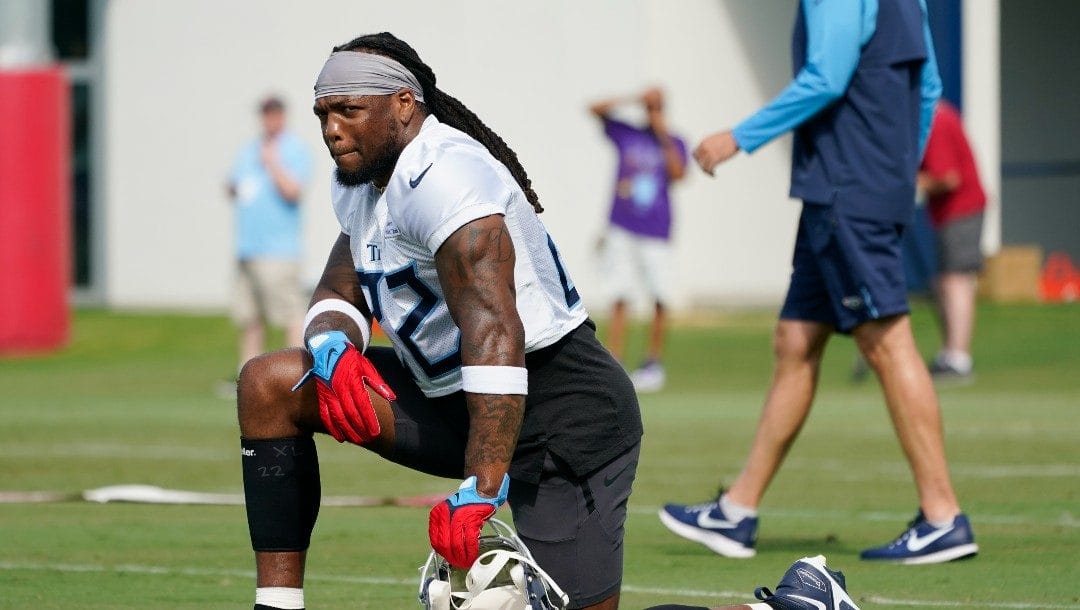 Tennessee Titans running back Derrick Henry (22) stretches at training camp at the NFL football team's practice facility Saturday, July 30, 2022, in Nashville, Tenn.