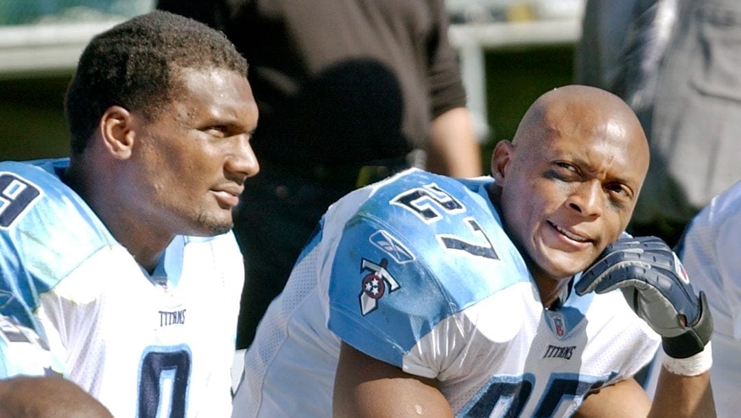 In this Sept. 29, 2002, file photo, Tennessee Titans running back Eddie George, right, and quarterback Steve McNair, sit on the bench after the Oakland Raiders scored in the third quarter of an NFL football game in Oakland, Calif.