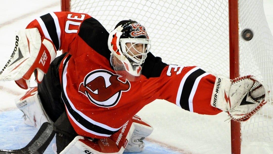 New Jersey Devils goaltender Martin Brodeur attempts to grab a loose puck during the second period of an NHL hockey game against the Phoenix Coyotes, Wednesday, Dec. 15, 2010, in Newark, N.J.