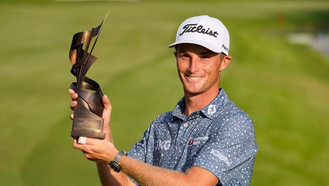 Will Zalatoris holds the trophy after winning the St. Jude Championship golf tournament, Sunday, Aug. 14, 2022, in Memphis, Tenn.