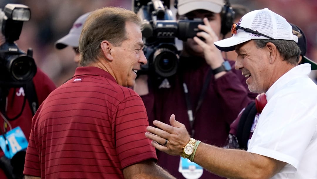 FILE - Alabama head coach Nick Saban, left, and Texas A&M head coach Jimbo Fisher, right, shake hands during pre-game of an NCAA college football game on Saturday, Oct. 9, 2021, in College Station, Texas. Alabama plays Texas A&M on Oct. 8, 2022, in Tuscaloosa. (AP Photo/Sam Craft, File)