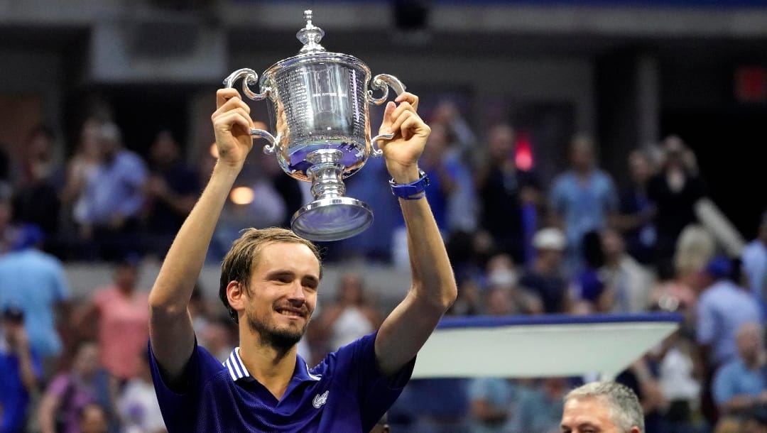 Daniil Medvedev, of Russia, holds the championship trophy after defeating Novak Djokovic, of Serbia, in the men's singles final of the US Open tennis championships, Sunday, Sept. 12, 2021, in New York.