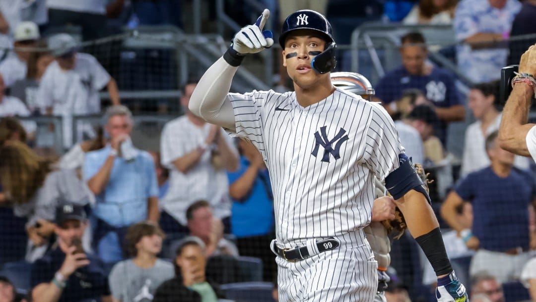 New York Yankees' Aaron Judge celebrates a home run in the third inning of a baseball game against the New York Mets, Monday, Aug. 22, 2022, in New York.