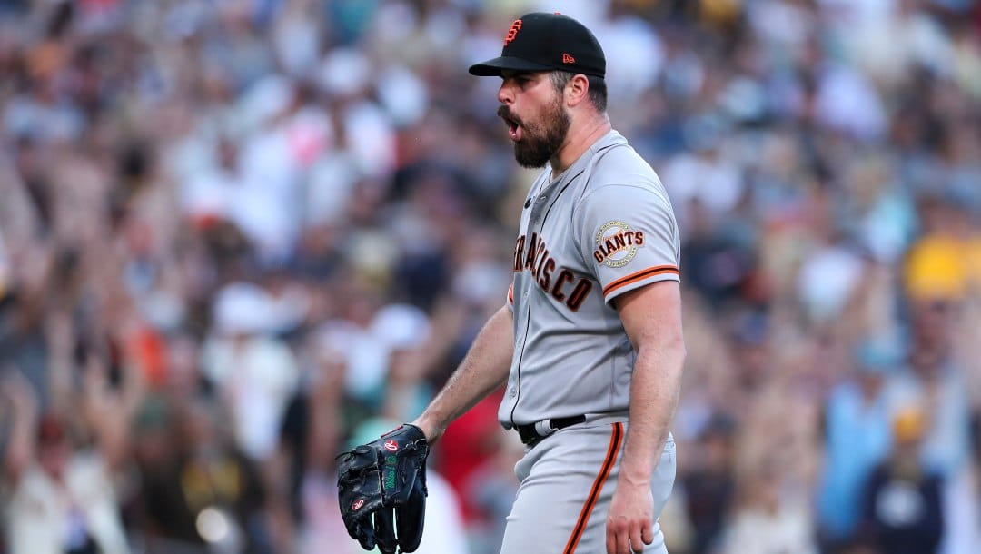 San Francisco Giants starting pitcher Carlos Rodon reacts after the team defeated the San Diego Padres in a baseball game Saturday, July 9, 2022, in San Diego.