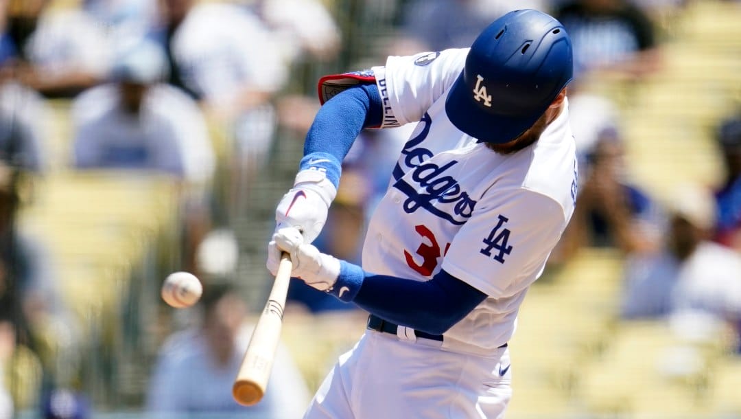 Los Angeles Dodgers' Cody Bellinger connects for a two-run home run during the second inning of a baseball game against the Miami Marlins, Sunday, Aug. 21, 2022, in Los Angeles.