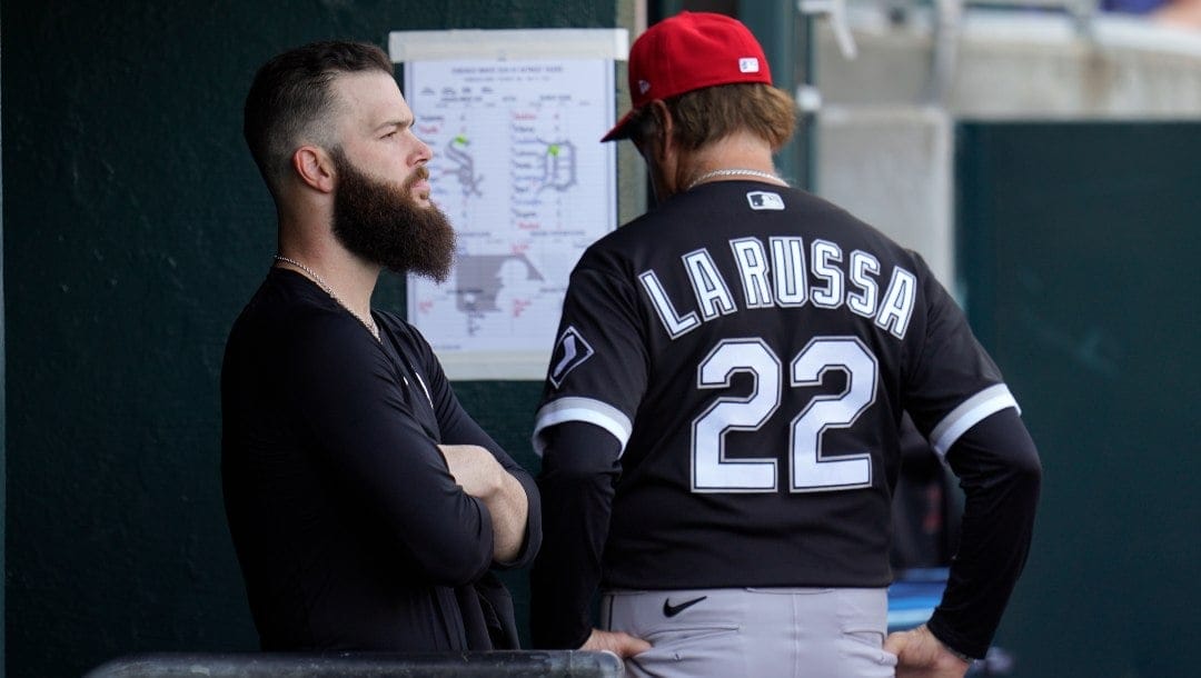 Chicago White Sox pitcher Dallas Keuchel watches from the dugout after being removed as manager Tony La Russa (22) checks the lineup in the fifth inning of a baseball game against the Detroit Tigers in Detroit, Saturday, July 3, 2021.