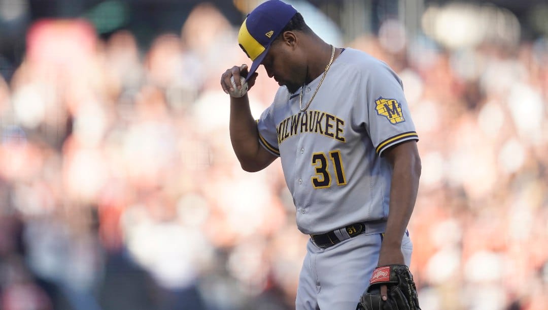 Milwaukee Brewers pitcher Jandel Gustave reacts after being called for a balk that scored San Francisco Giants' Wilmer Flores during the eighth inning of a baseball game in San Francisco, Saturday, July 16, 2022.
